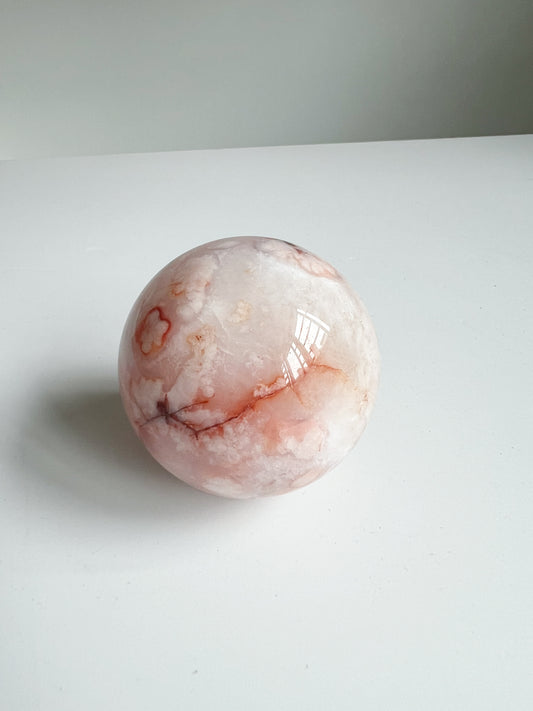 Carnelian Flower Agate sphere with gentle veining and warm blush undertones like sakura