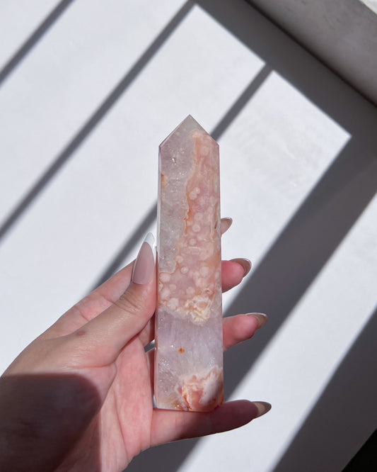 Front view of tower showing layered inclusions and soft pastel banding