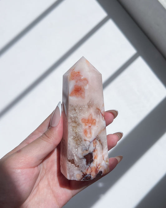 Close-up of tower showcasing peach and burnt orange plumes