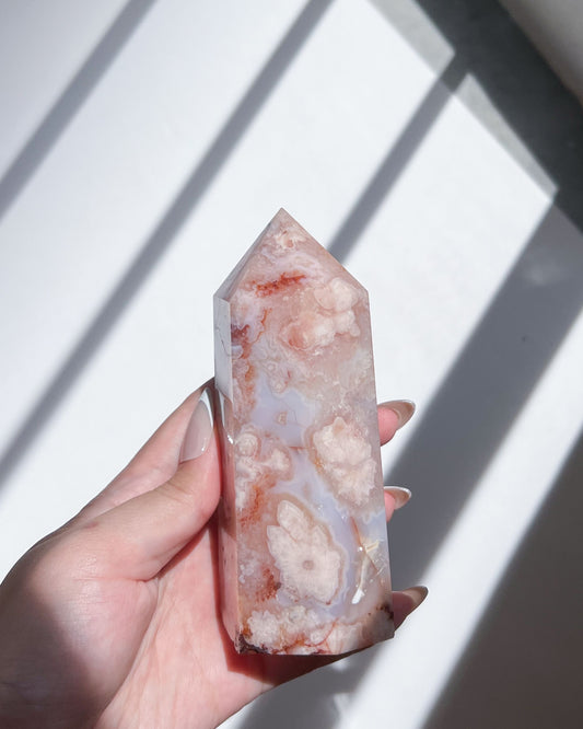 Side profile of Renoir Carnelian flower agate tower showcasing rose-hued inclusions and white plumes