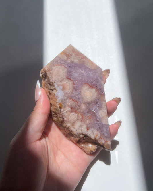 Back view of Naomi with quartz bloom clusters and natural raw edging