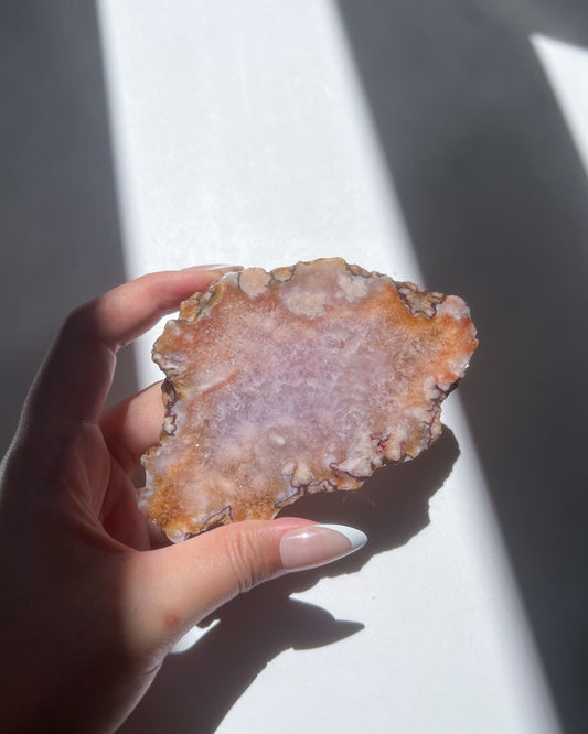 Front view of Ella slab in sunlight, highlighting lavender core and textured flower formations
