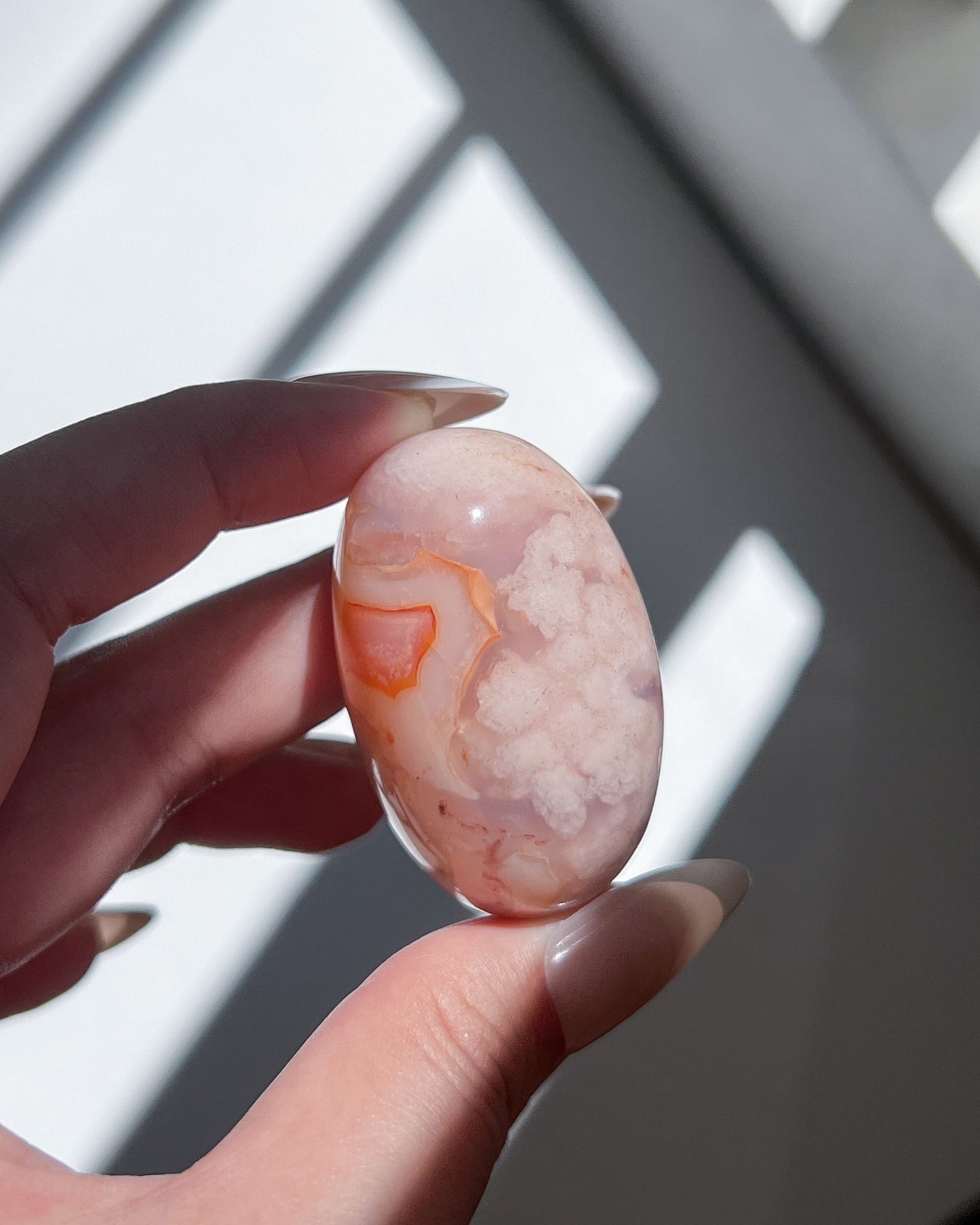 Carnelian Flower Agate Tumble No. 11 — pastel pink crystal with soft floral plumes and dreamy banding.