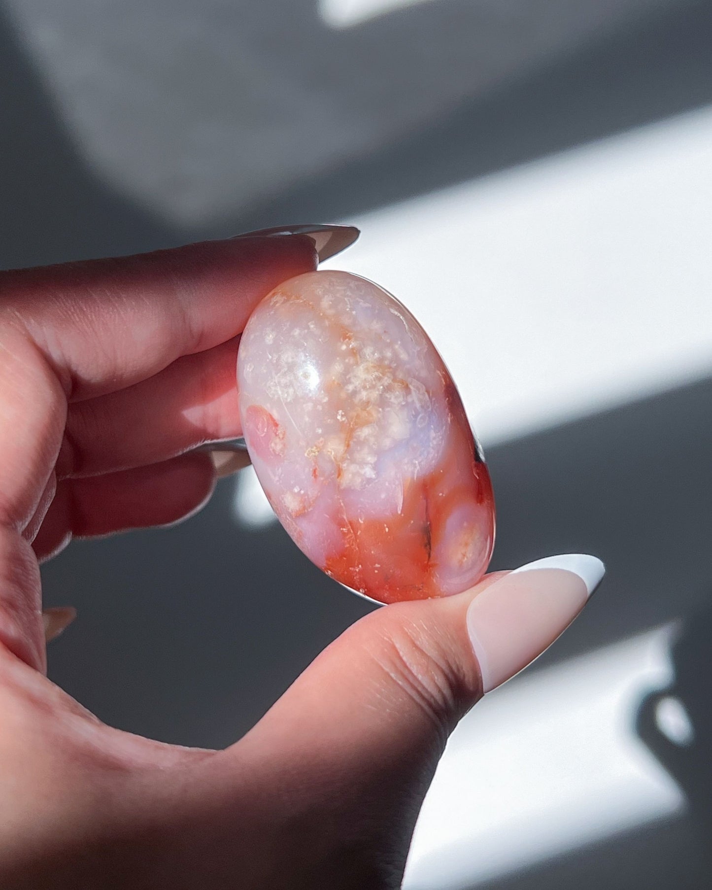 Carnelian Flower Agate Bean No. 14 — pastel pink crystal with soft floral plumes and dreamy banding.