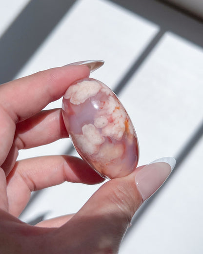 Carnelian Flower Agate bean in red, lilac blue and white, showcasing dense pastel plume formations