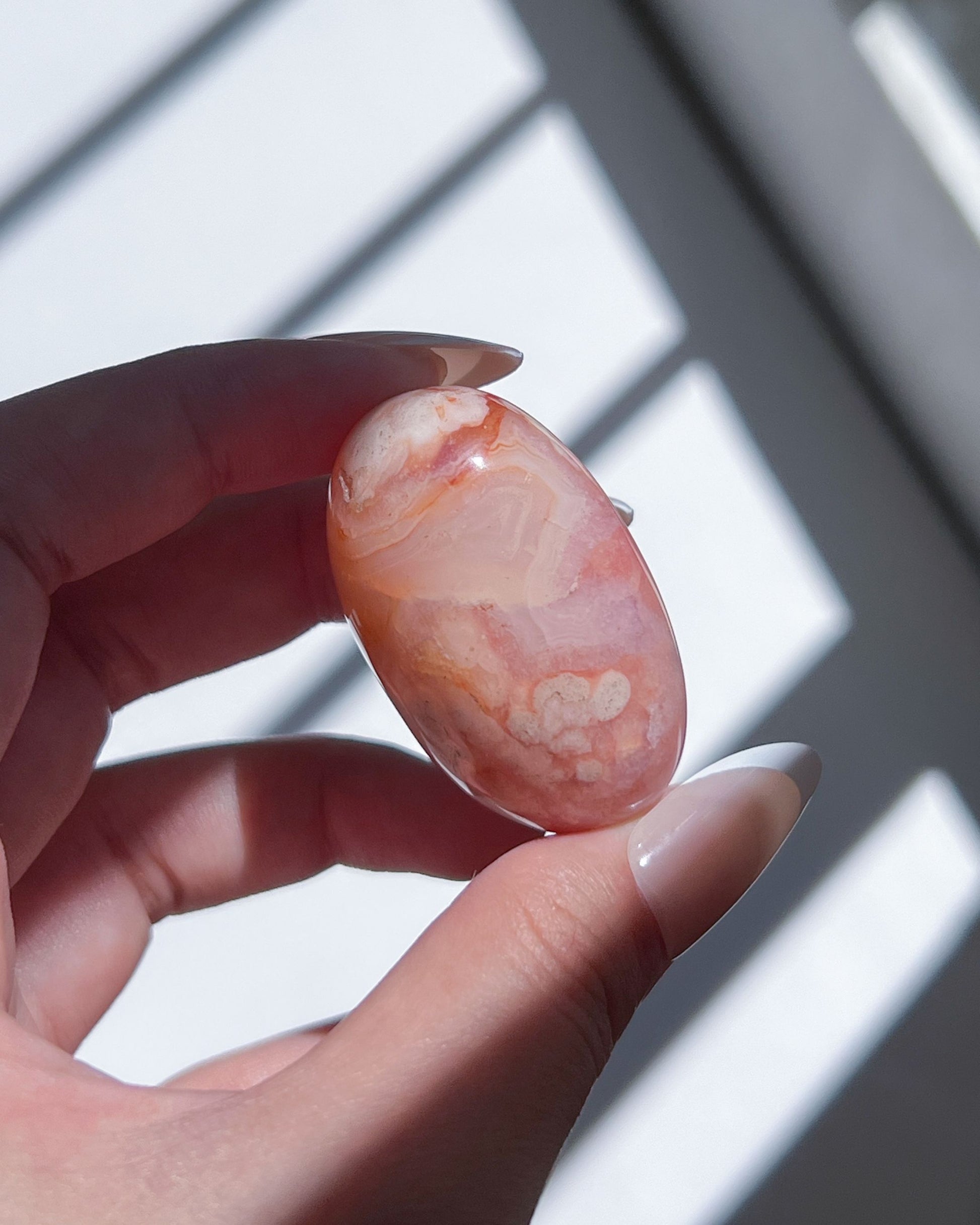 Carnelian Flower Agate Tumble No. 9 — pastel pink crystal with soft floral plumes and dreamy banding.