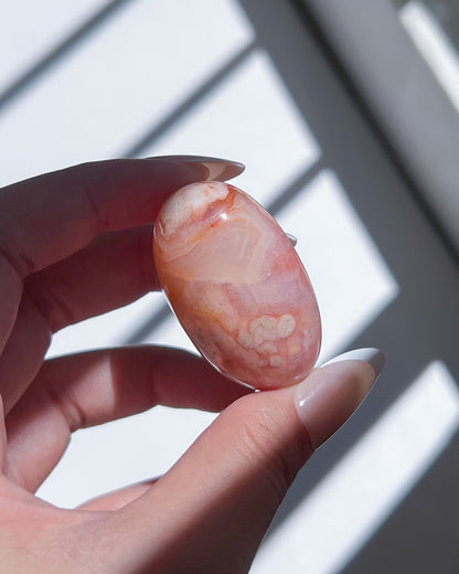Carnelian Flower Agate Tumble No. 9 — pastel pink crystal with soft floral plumes and dreamy banding.
