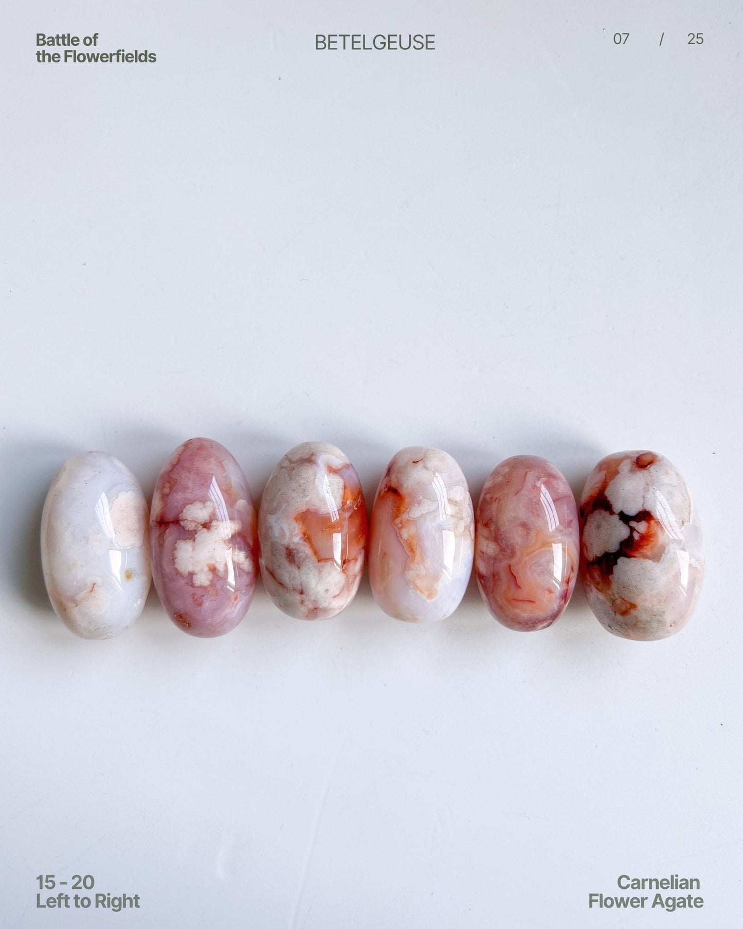 Carnelian Flower Agate tumbles lineup (15–20), showcasing vintage old-stock pieces with blue tinge and candy-like hues – left to right arrangement