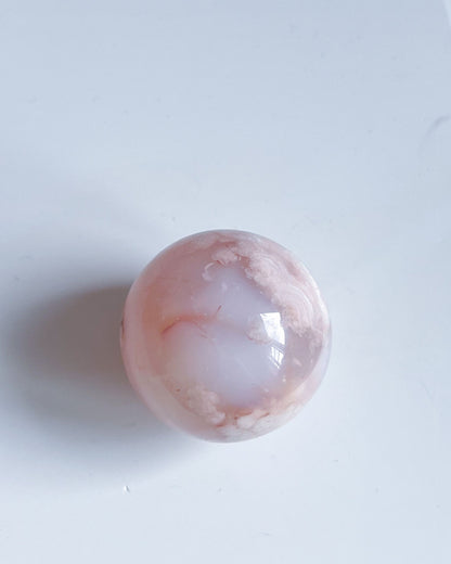 Top-down view of Sphere 10 Suki revealing gentle internal patterns and pastel banding