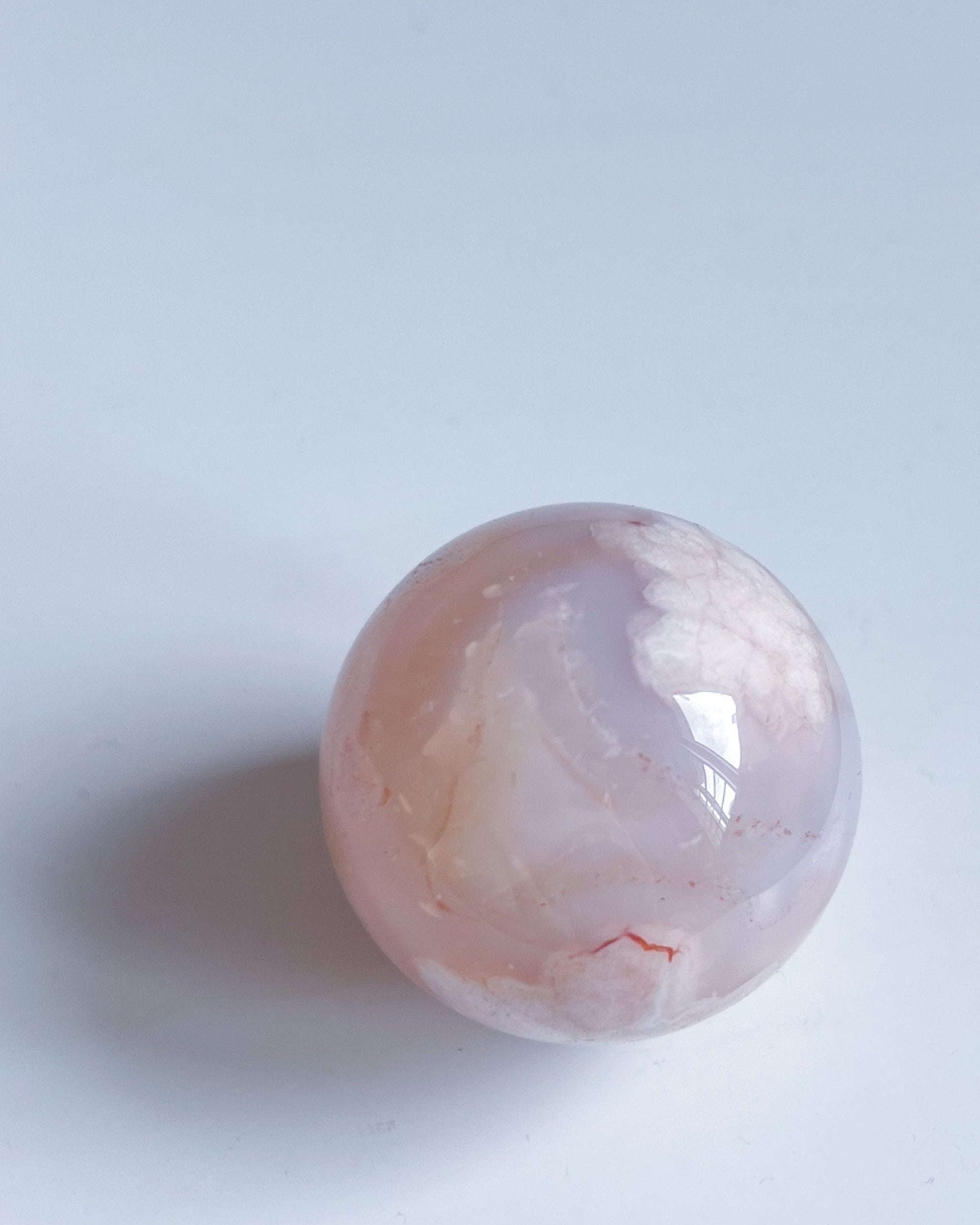 Front view of Sphere 10 showing blooming patterns and faint carnelian accents