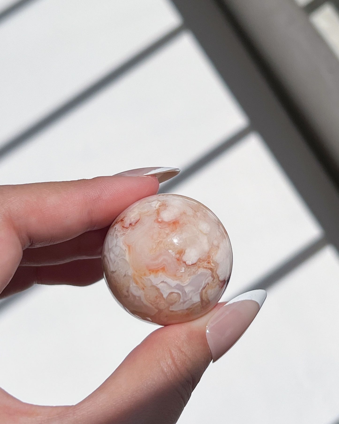 Detailed shot of sphere 08 with orange lace blooms and layered crystalline zones.
