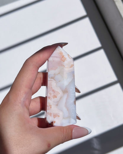 Close-up of tower base featuring soft banding and floral-like patterns