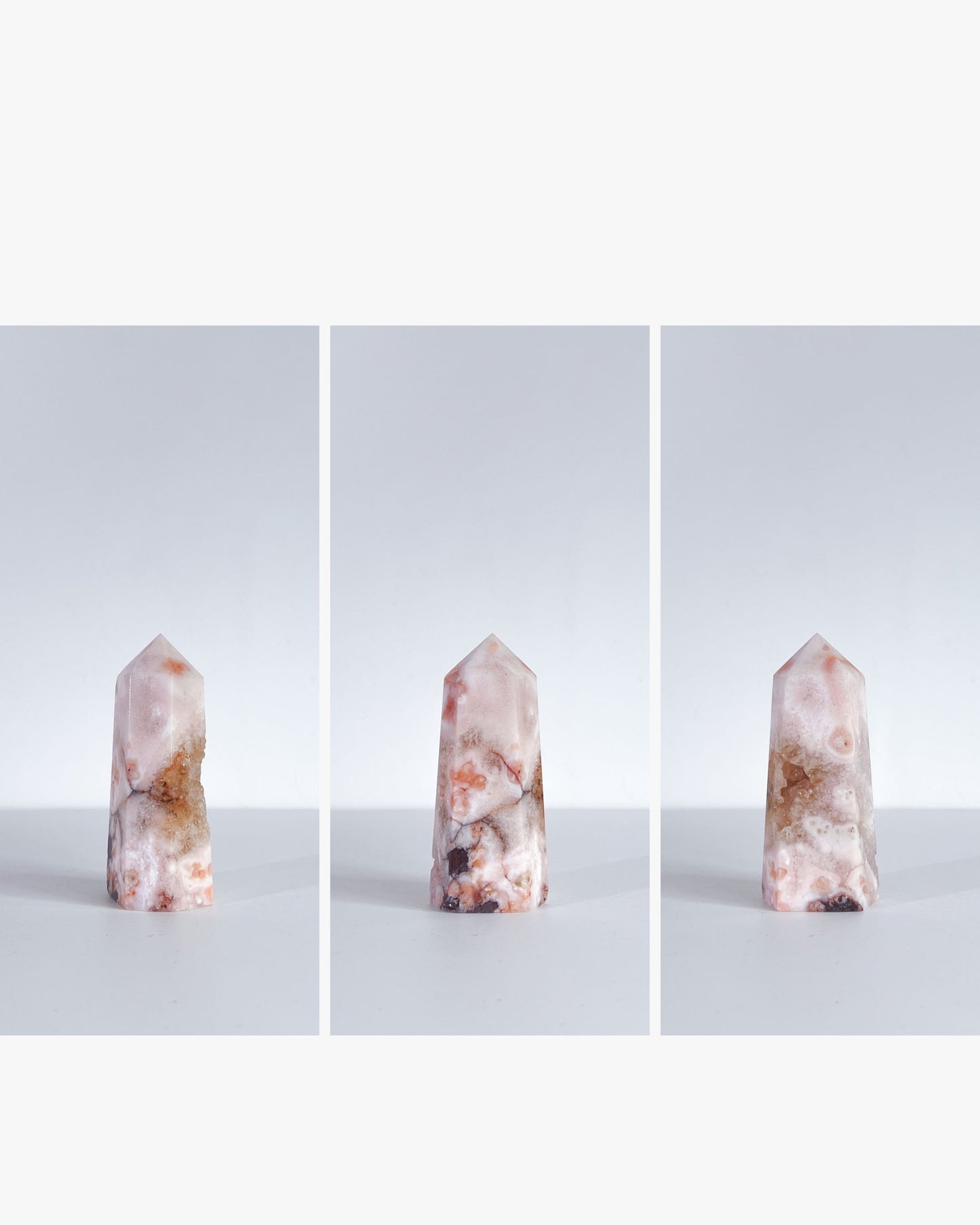 Trio display of the same Carnelian Flower Agate tower in clean editorial style