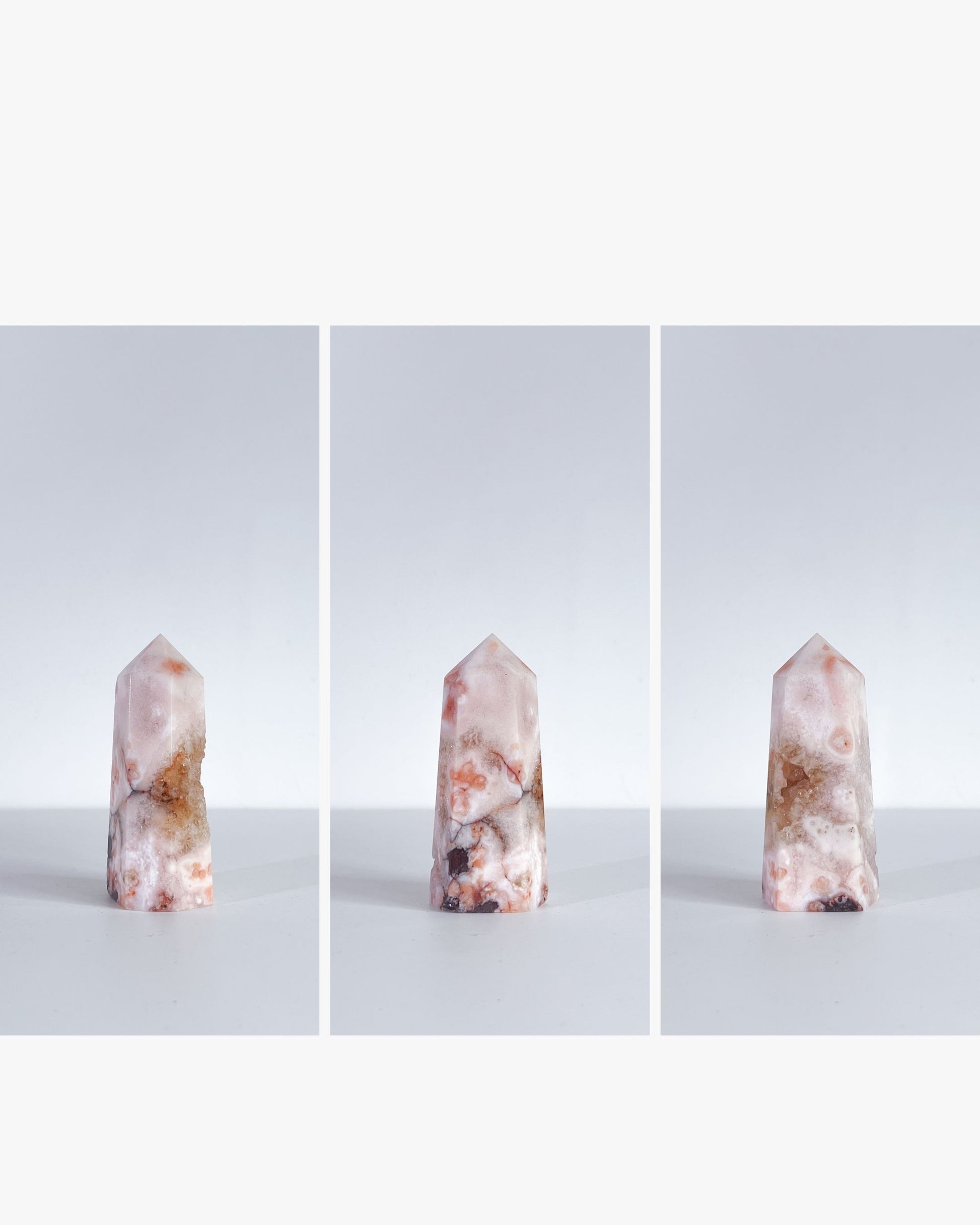 Trio display of the same Carnelian Flower Agate tower in clean editorial style