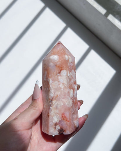 Side view showing big floral plume, crystallised interior and light peach inclusions