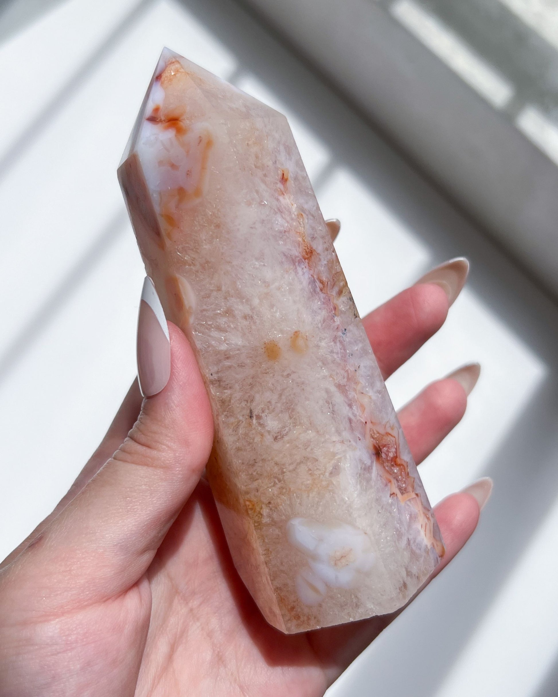 Close up focus view capturing intricate quartz formation, internal shimmer and daisies.

