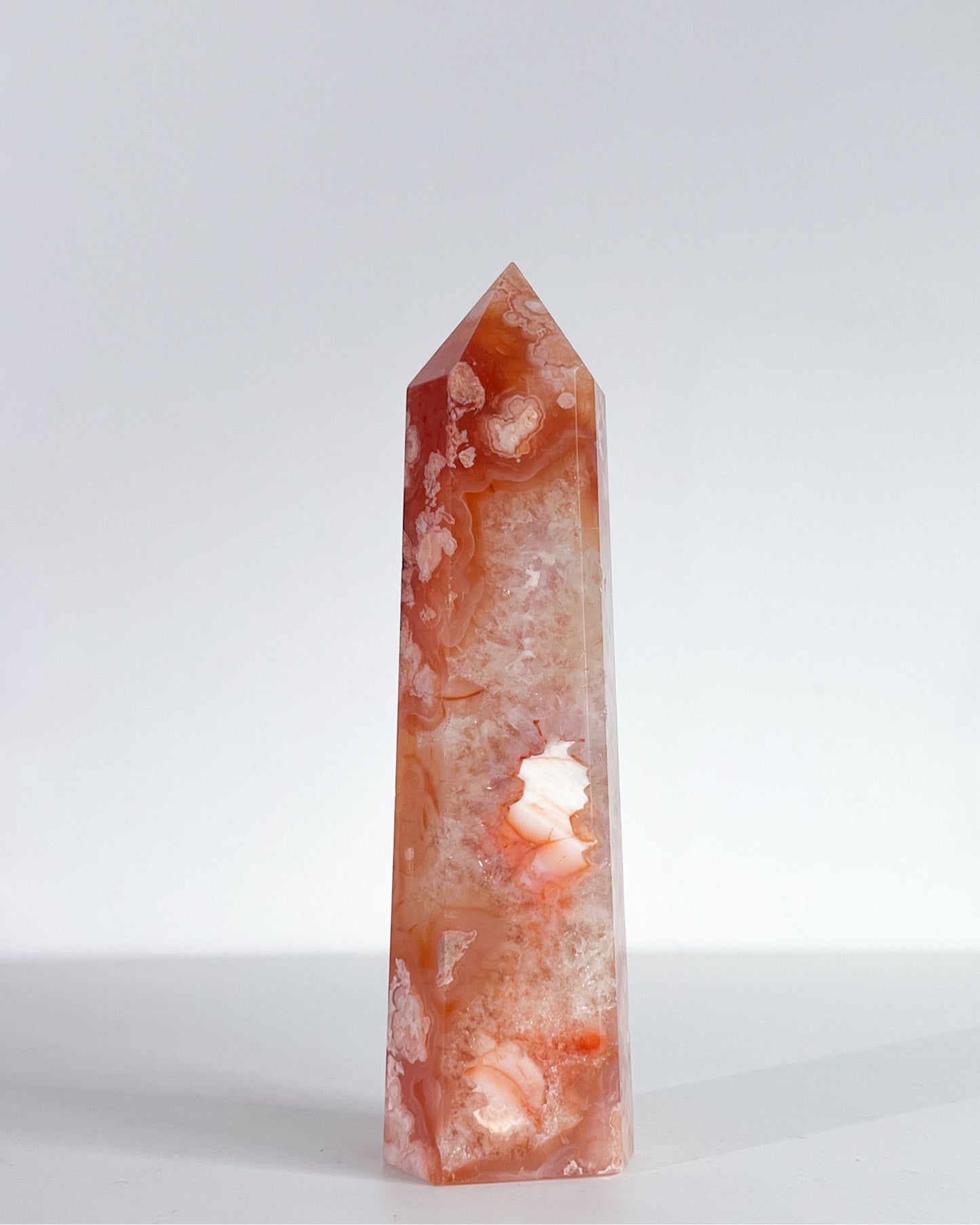 Studio shot of Saffron tower, showing dense white crystal core with surrounding petal-like inclusions