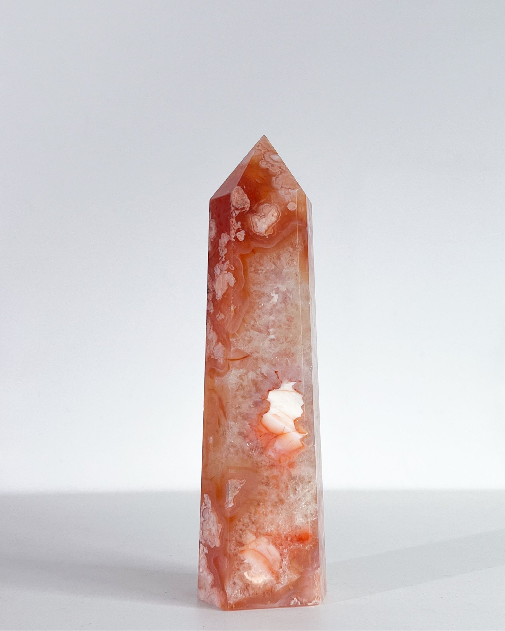 Studio shot of Saffron tower, showing dense white crystal core with surrounding petal-like inclusions