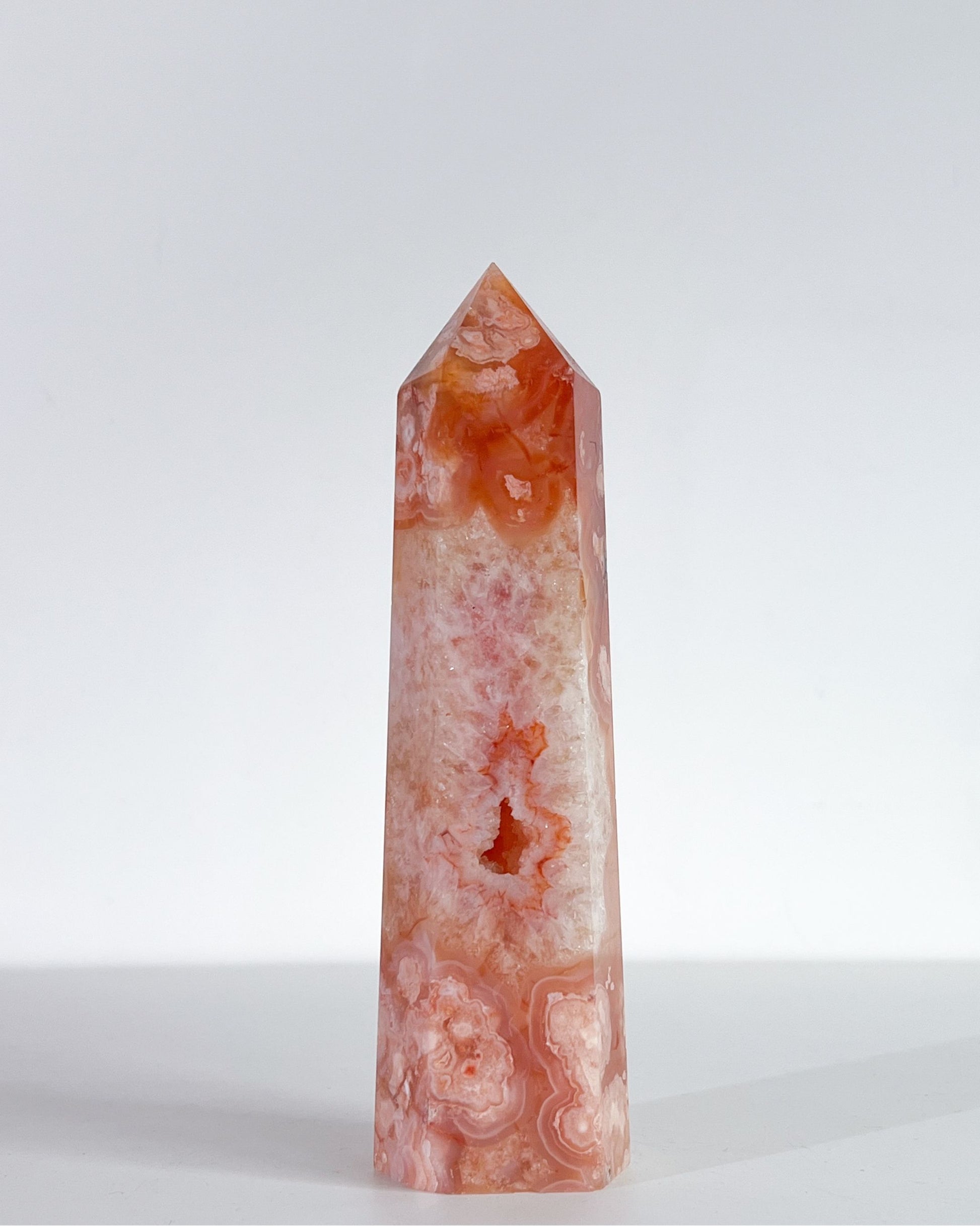 Detail shots of Saffron's soft quartz textures and glowing orange flower-like formations