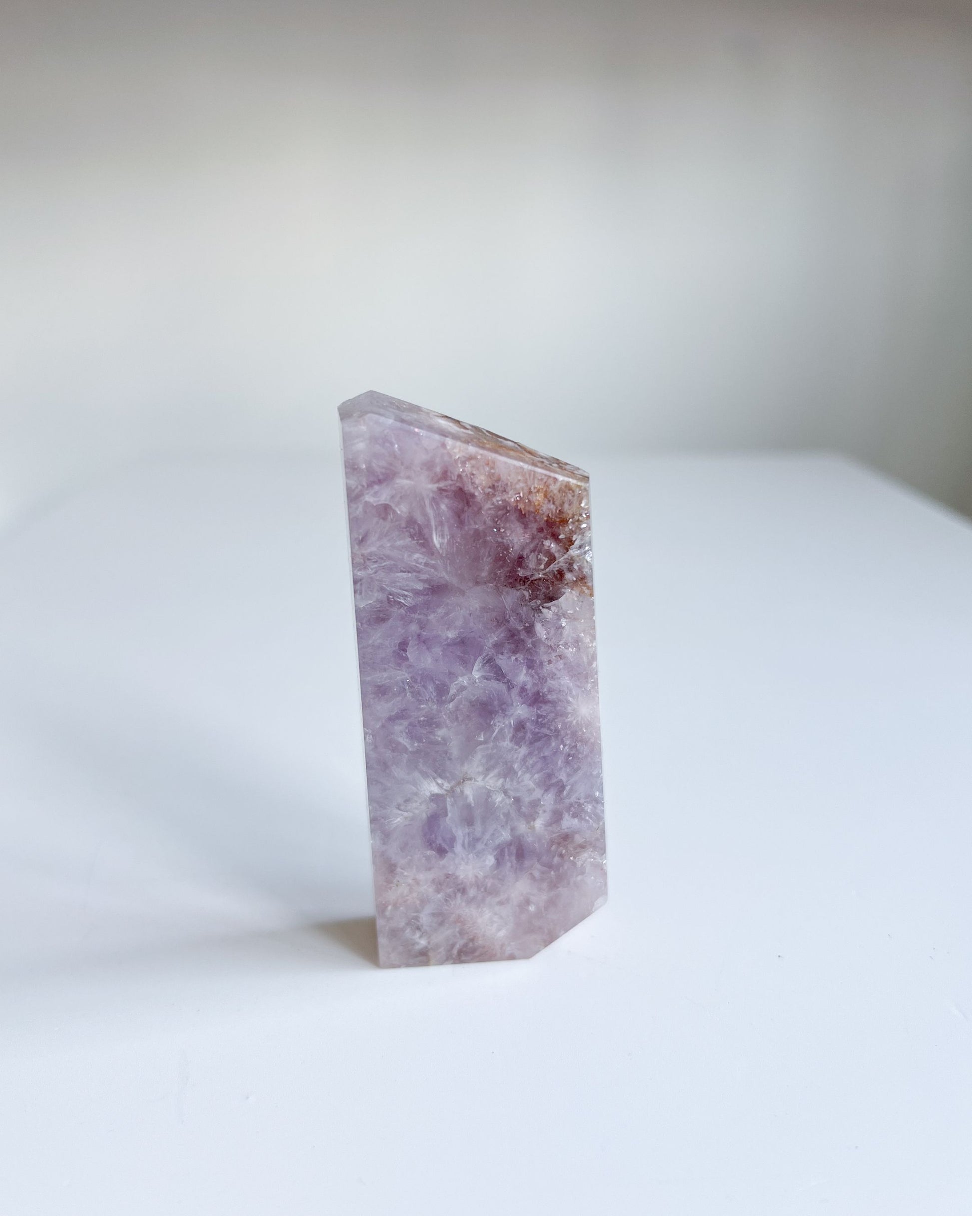 Leia flower agate slab standing upright showing amethyst patterns and clarity