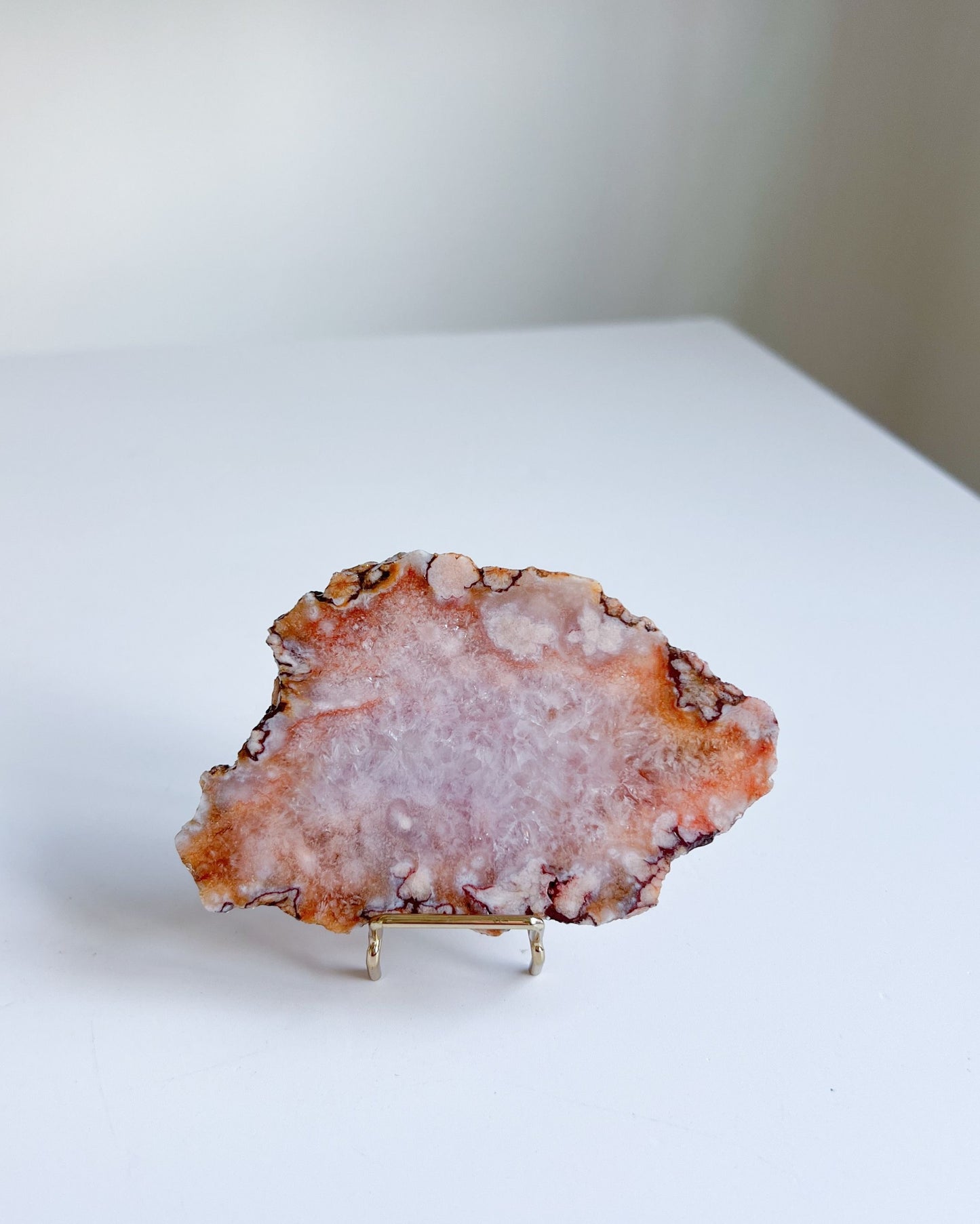 Ella displayed on stand showing crystallized center and burnt sienna outer layer