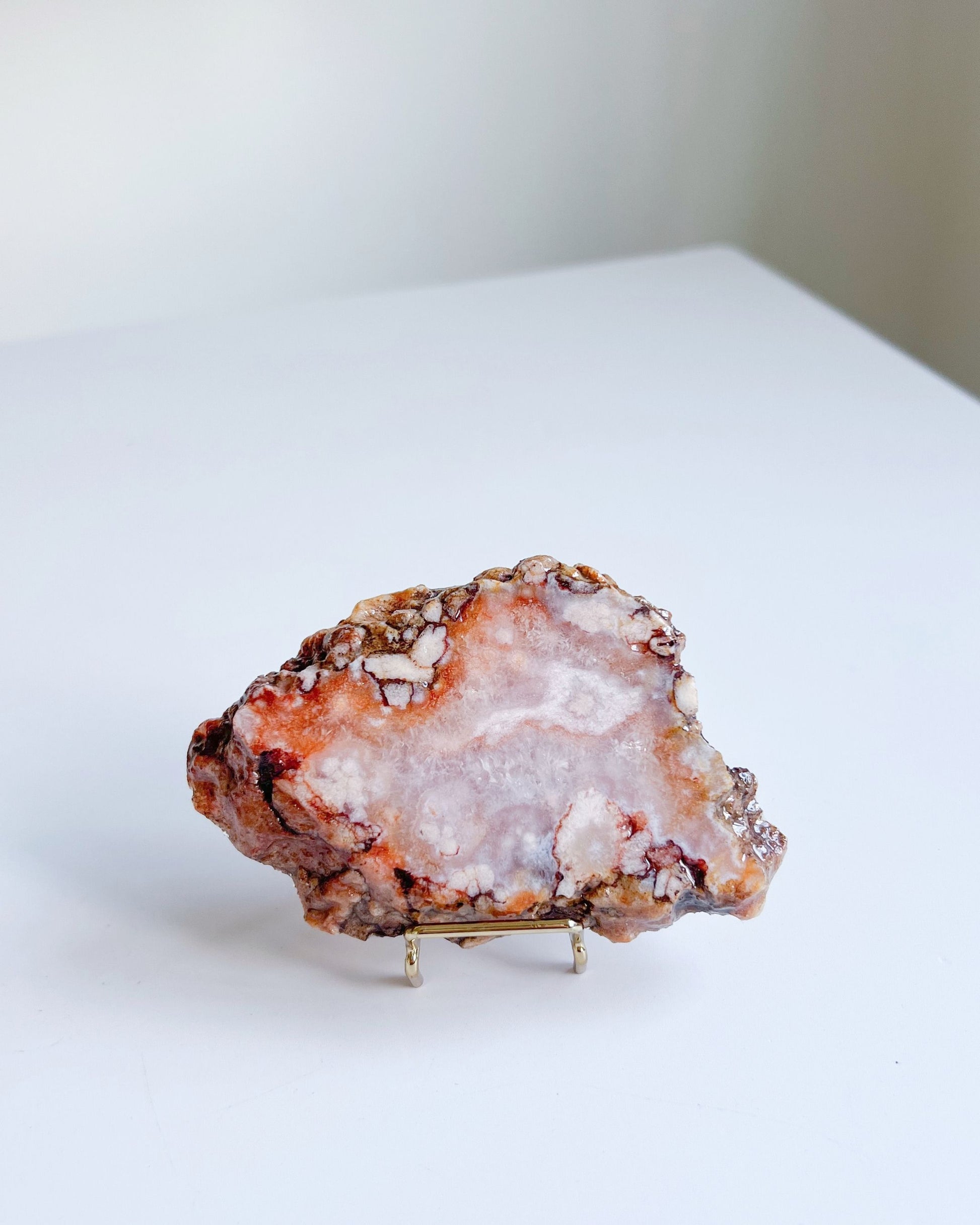 Reverse side of Ella showcasing raw mineral edge and orange-cream quartz