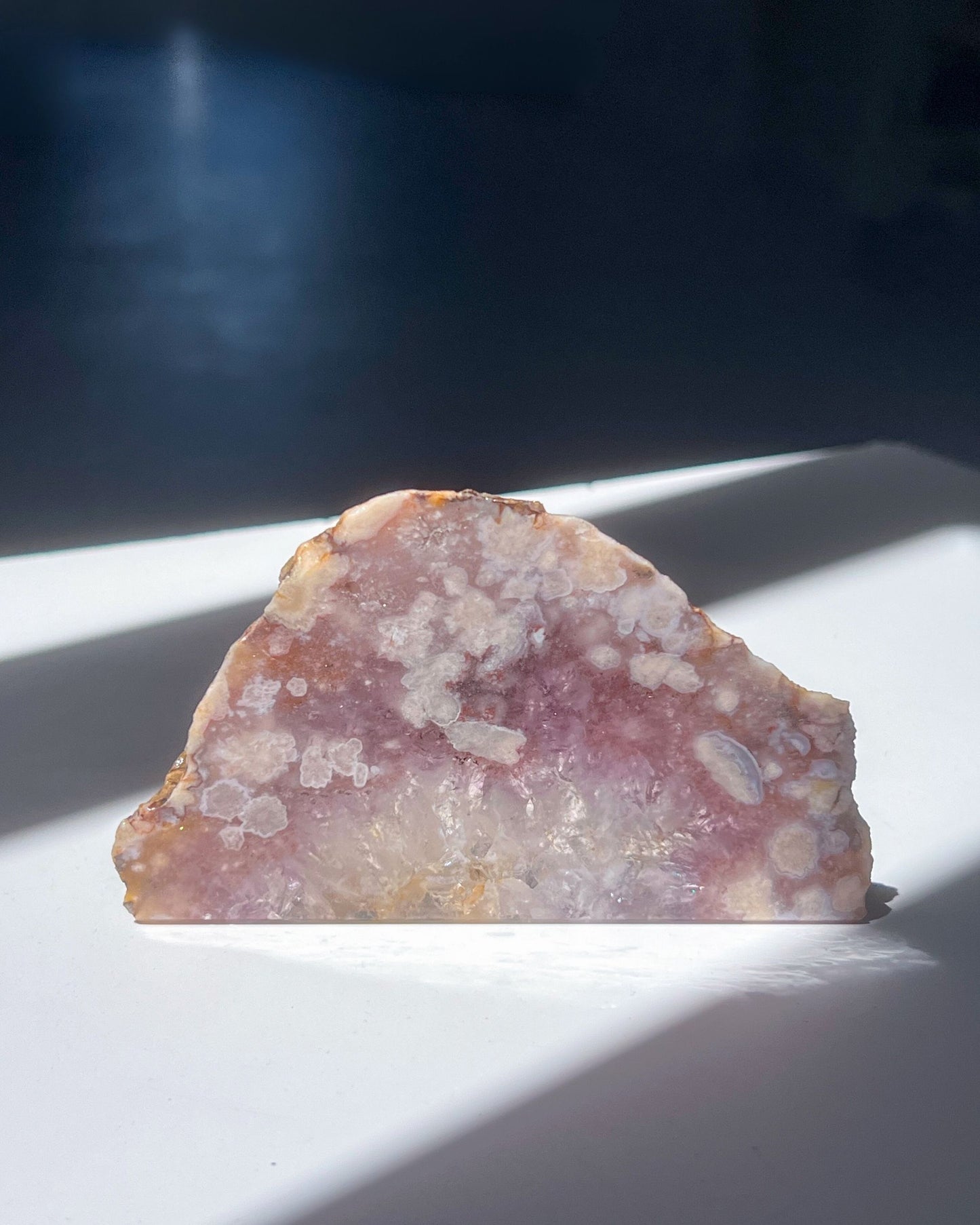 Front view of Avery Flower Agate slab with glowing crystalline core and soft cloudy blooms
