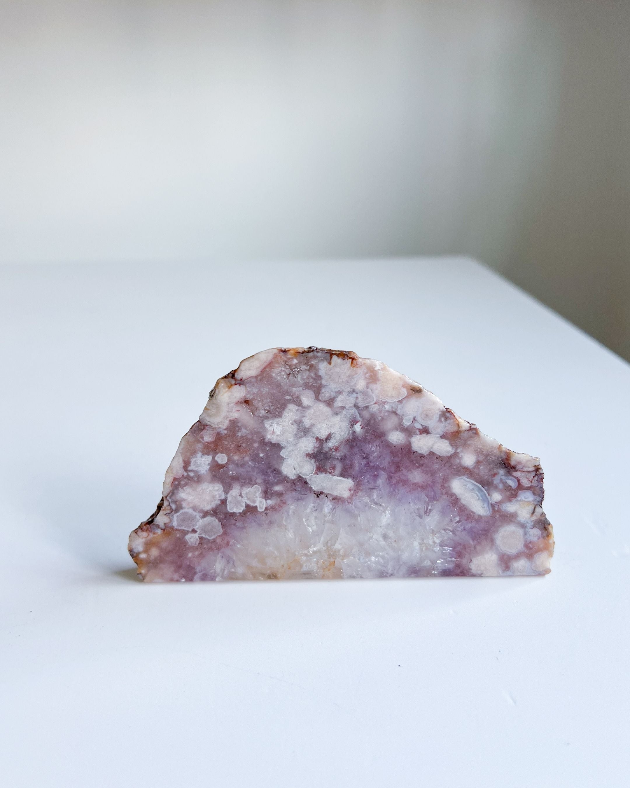 Avery Flower Agate slab on clean white background highlighting half-moon silhouette