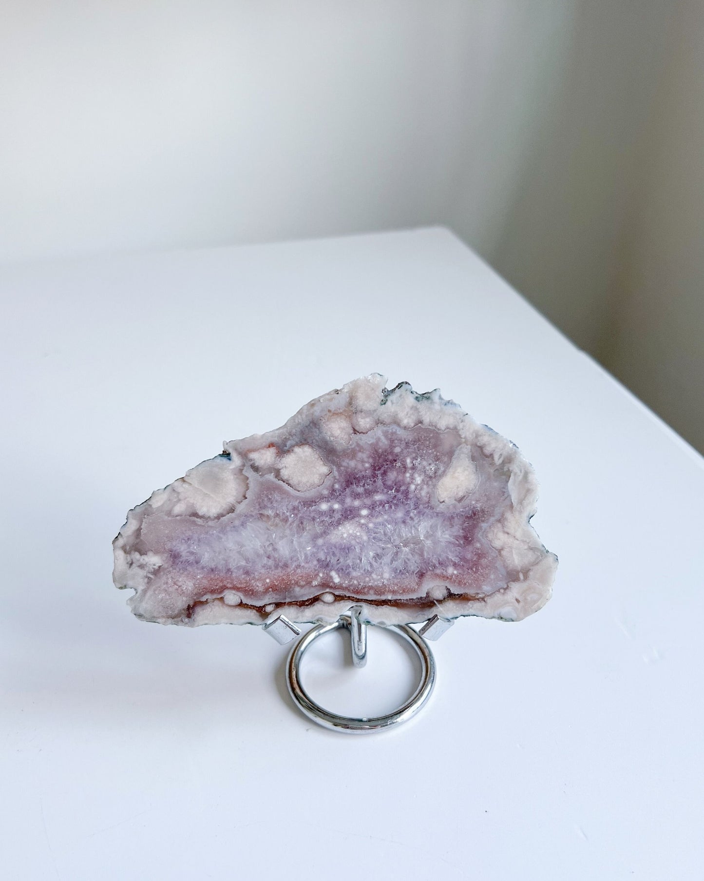 Eleanor standing on metal stand, showing intricate crystal details and soft shimmer