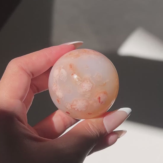 Video of Carnelian Agate Sphere Hana in sunlight