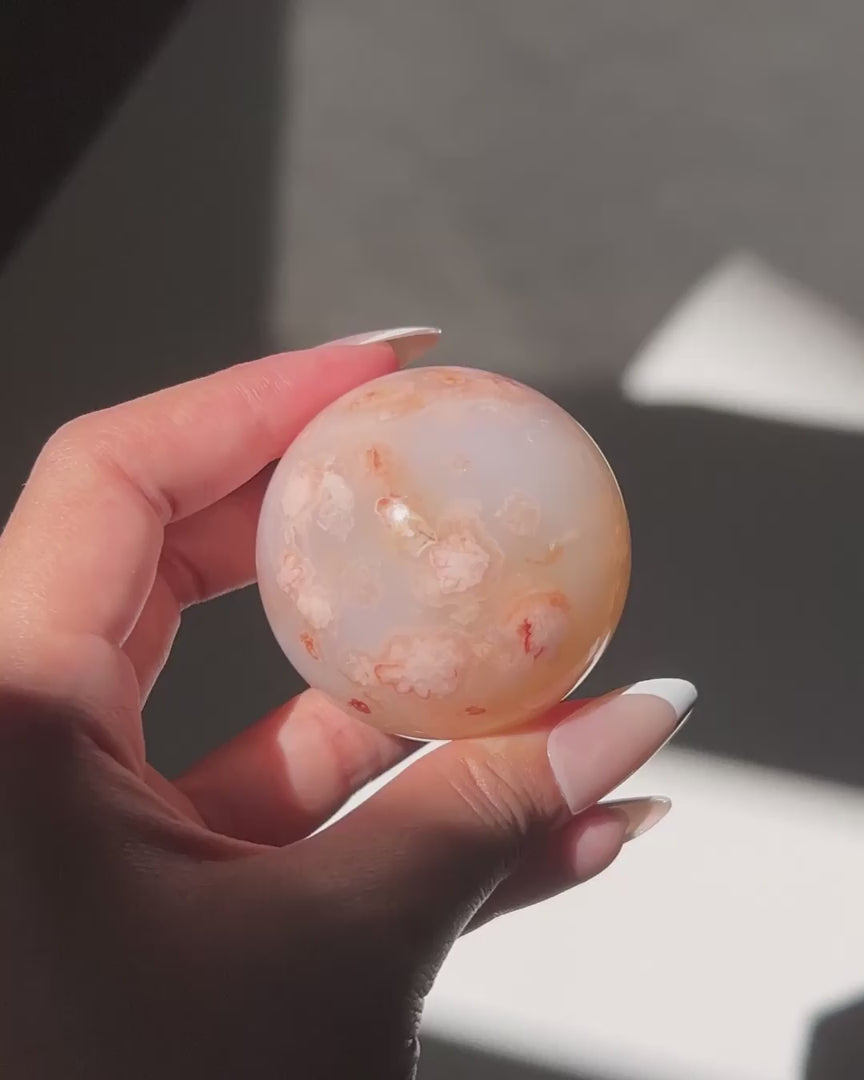 Video of Carnelian Agate Sphere Hana in sunlight