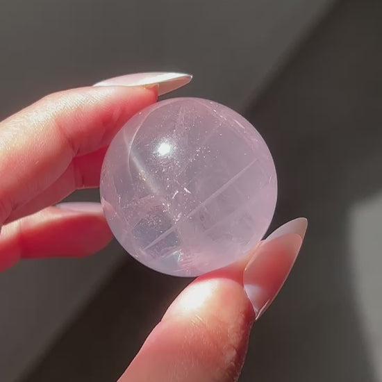 Clear glowy watery Girasol Rose Quartz in sunlight, flashlight and room lighting.
