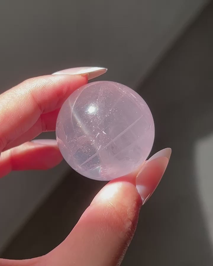 Clear glowy watery Girasol Rose Quartz in sunlight, flashlight and room lighting.