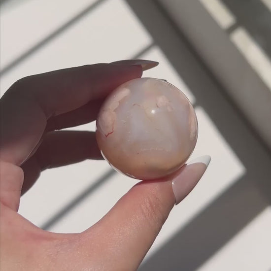 Video of Carnelian Agate Sphere Suki in sunlight
