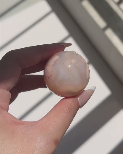 Video of Carnelian Agate Sphere Suki in sunlight