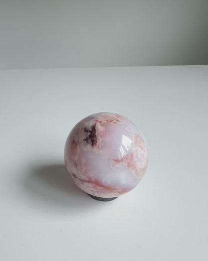 Video of a creamy blue and red toned Carnelian Flower Agate Sphere 46A