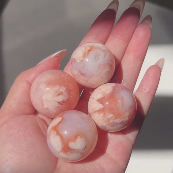 Compilation of Carnelian Flower Agate Spheres 1 to 4 in sunlight.