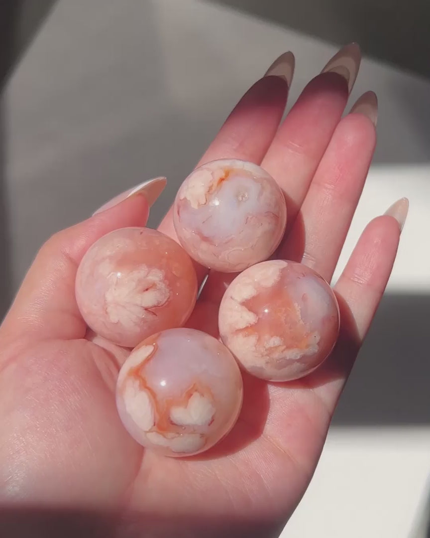 Compilation of Carnelian Flower Agate Spheres 1 to 4 in sunlight.